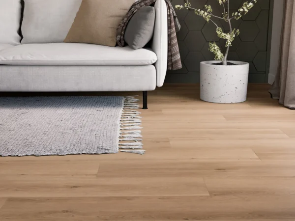 Plant light gray couch Portercraft Wide Plank Acorn luxury vinyl plank flooring